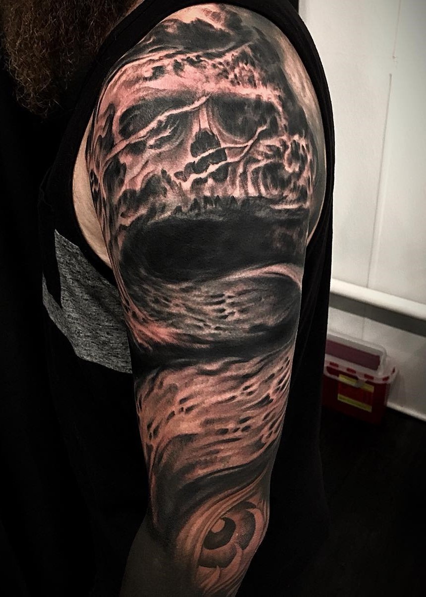 Evil Skull tattoo sleeve done in black and grey by tattoo artist Alan Lott at Sacred Mandala Studio in Durham, NC.